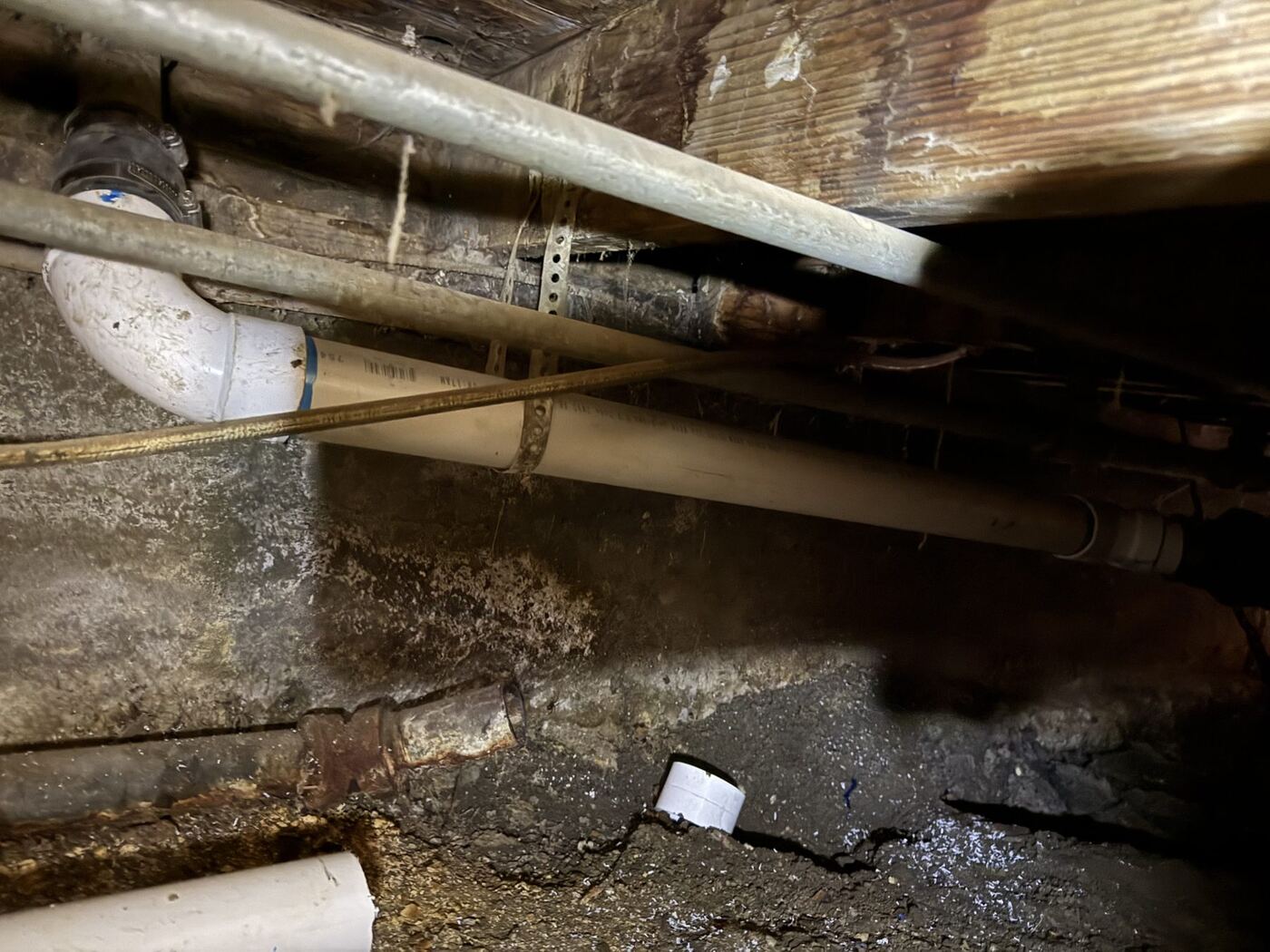 Drain line repair under a home in Bakersfield, CA