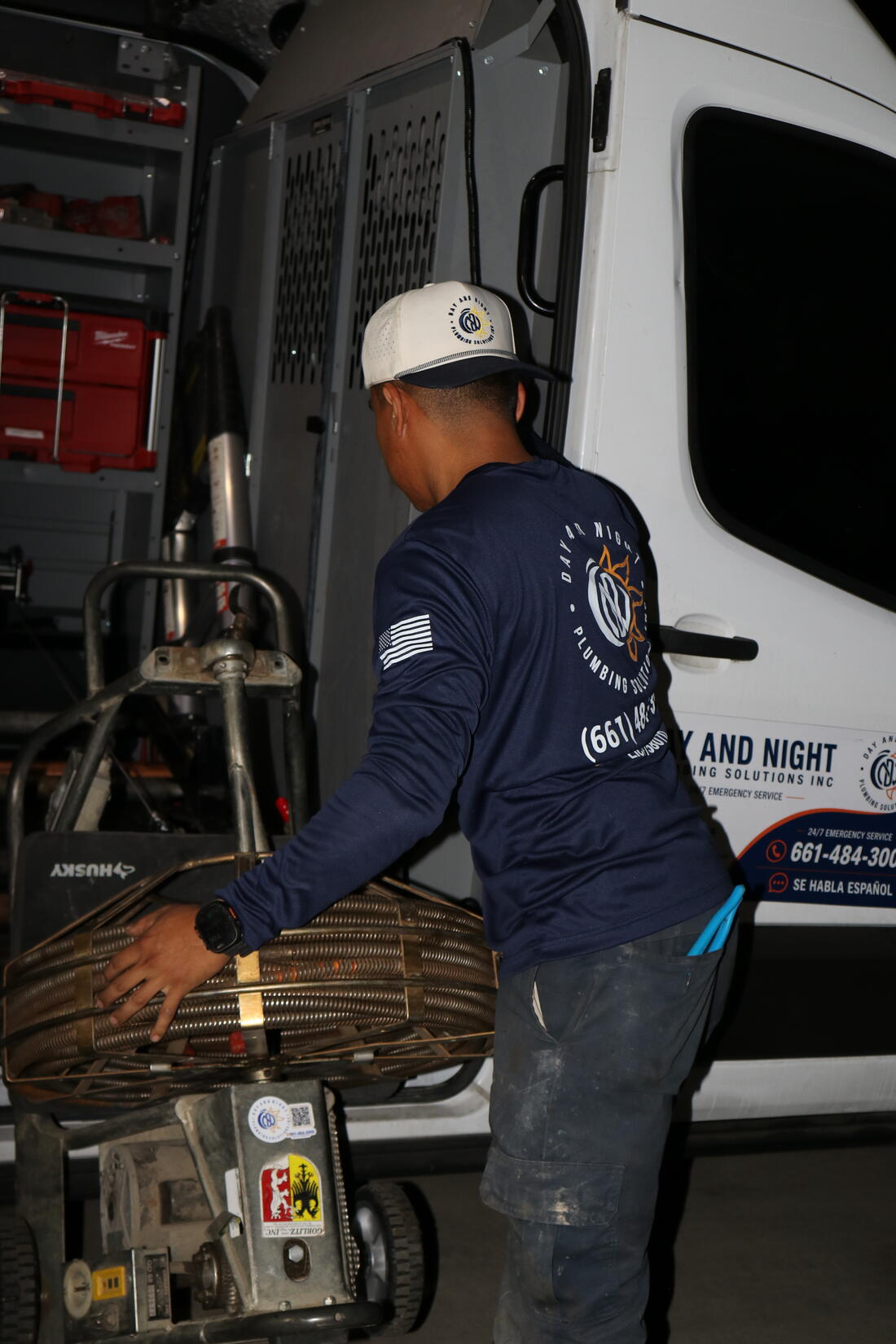 Day and Night Plumbing service van stocked with drain cleaning equipment
